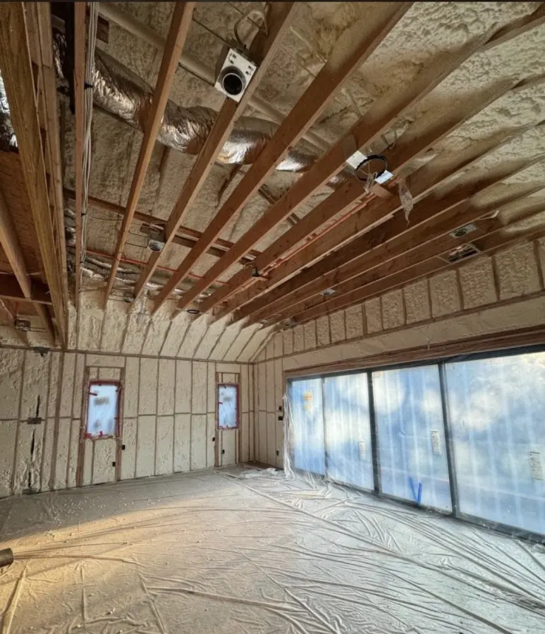 Interior walls and ceiling insulated with spray foam during new construction in Rochelle