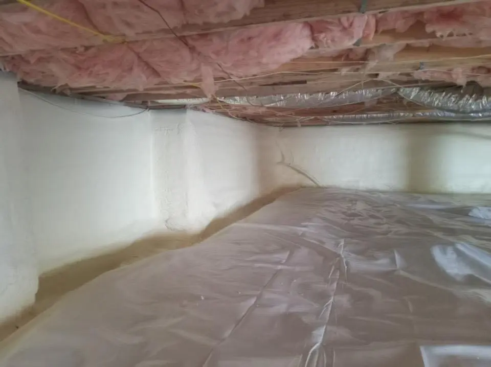 Crawl space encapsulation with closed-cell spray foam for Commercial Roof Restoration in Rochelle